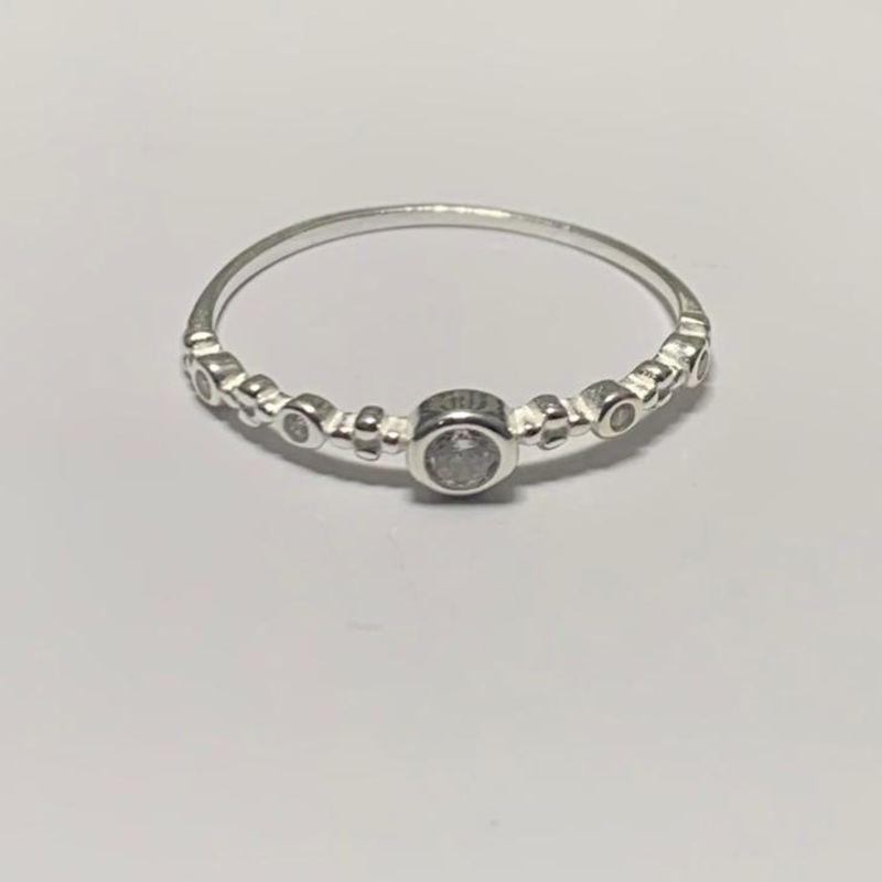 ANEL PONTO DE LUZ COM DETALHE LATERAL CRAVEJADO PRATA 925